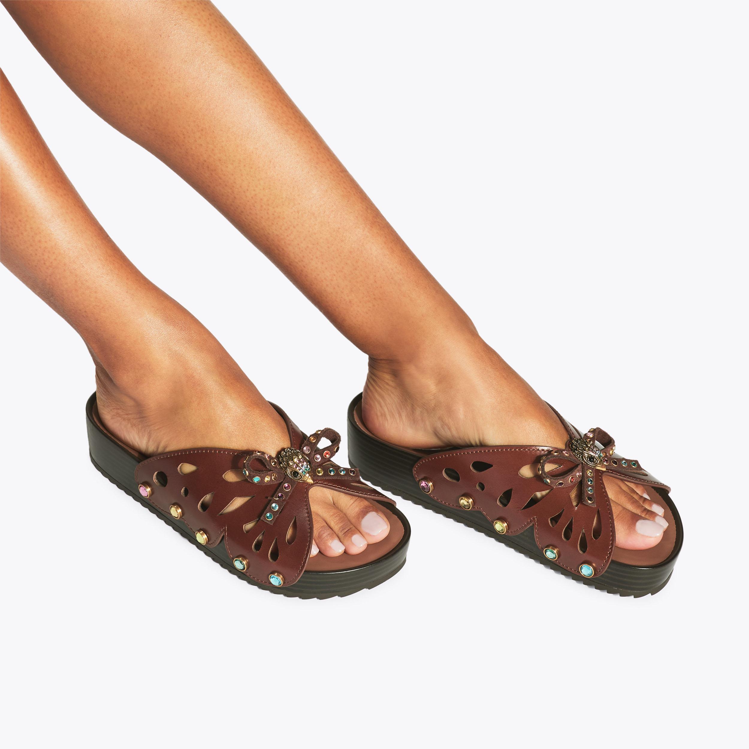 Boho Butterfly Flat — Brown Leather Crystal Sandal, worn on foot