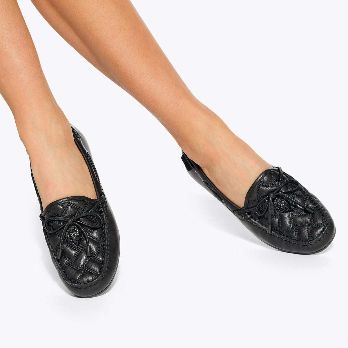 Eagle Moccasin — Black Leather Flat, worn on foot