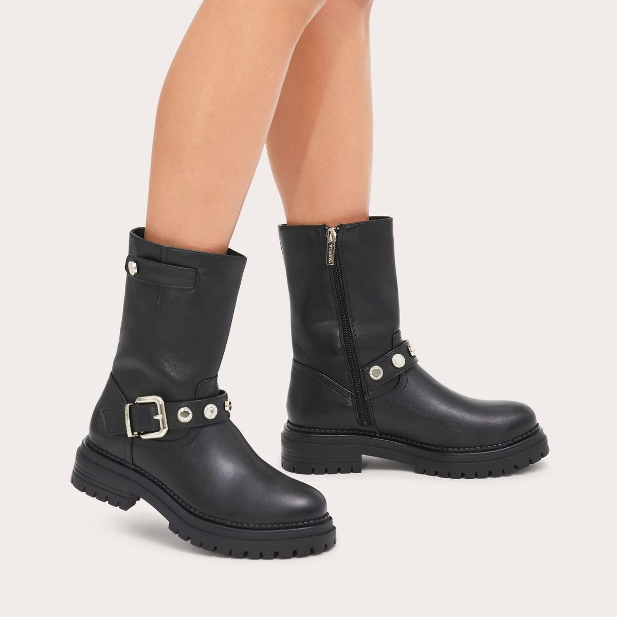Headline Coin — Black Ankle Boot, worn on foot