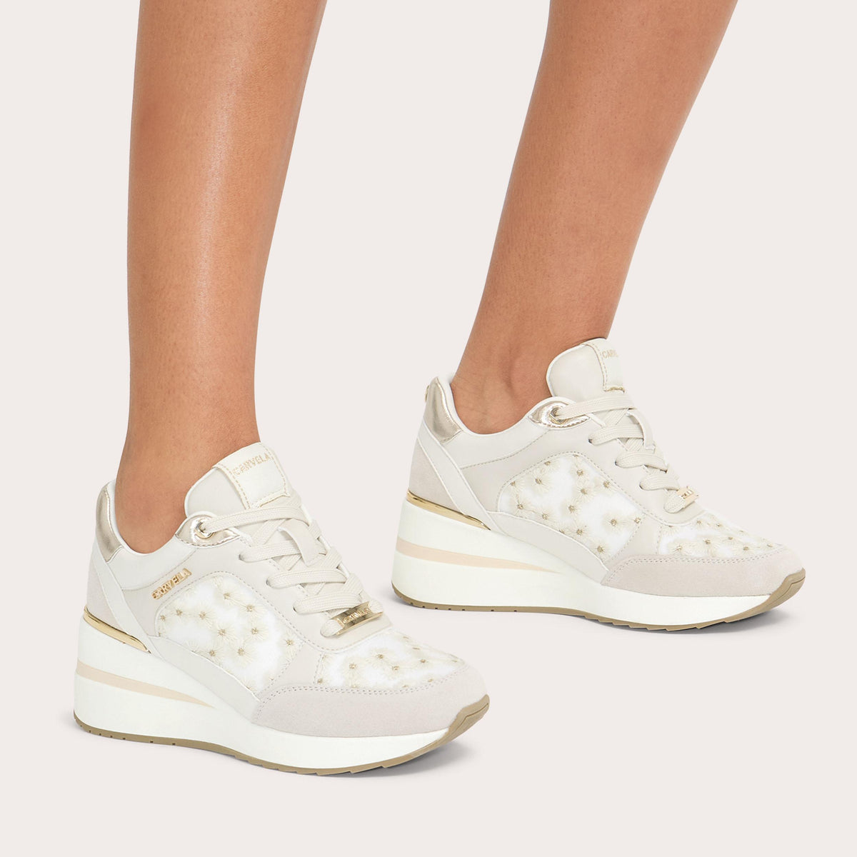 High Rise Daisy — White Fabric Trainer, worn on foot