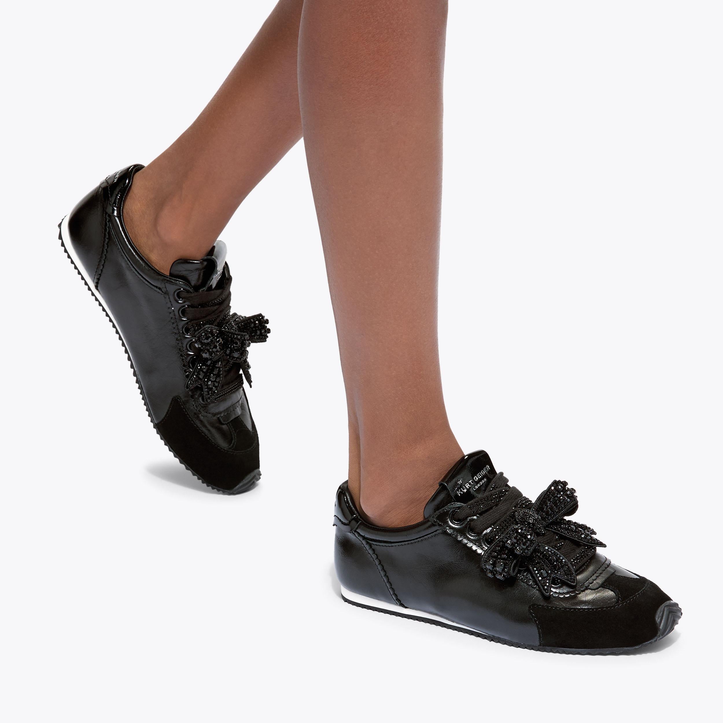 Islington Drench Bow — Black Leather Sneaker, worn on foot