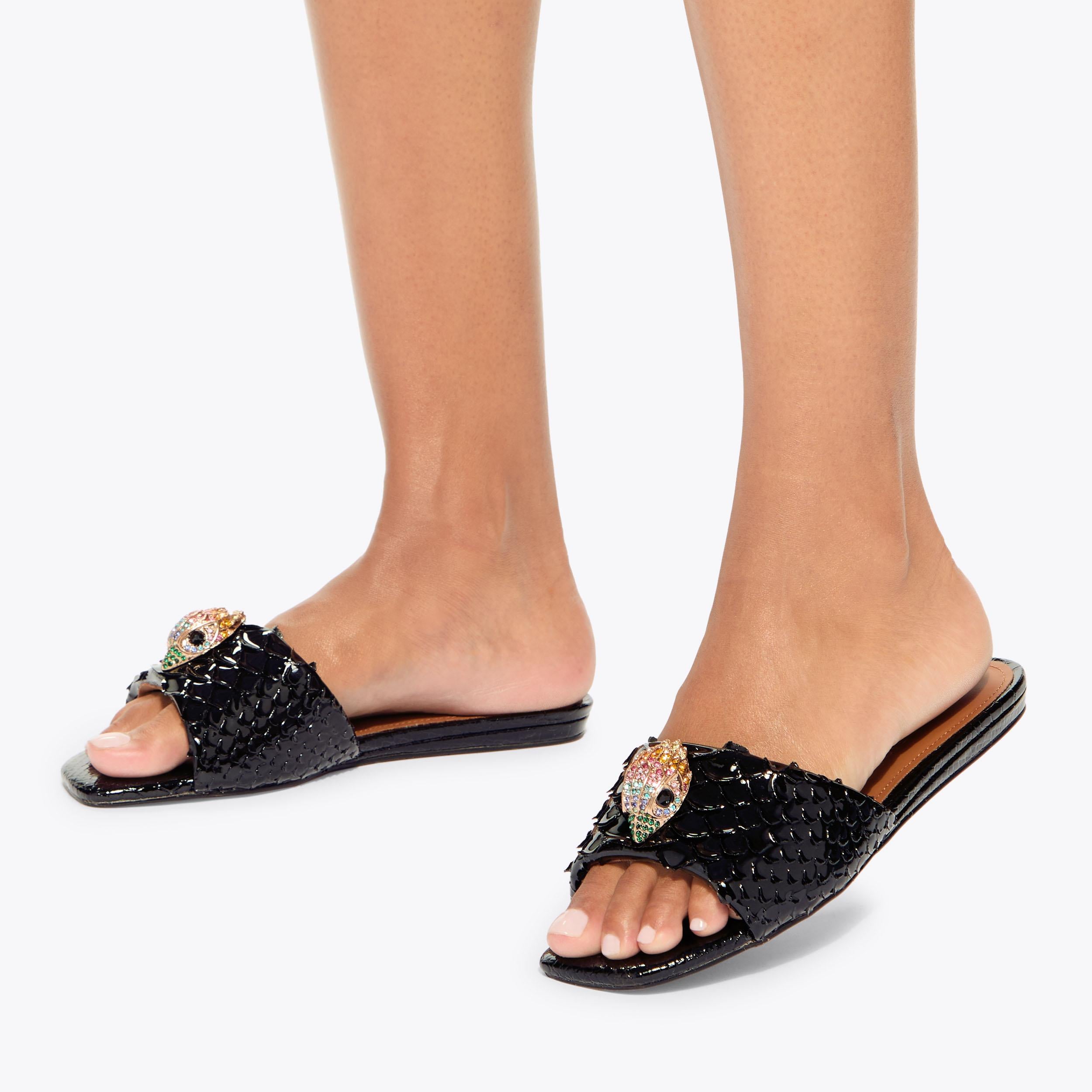 Kensington Flat Sandal — Black Lizard-Embossed Leather Slide, worn on foot