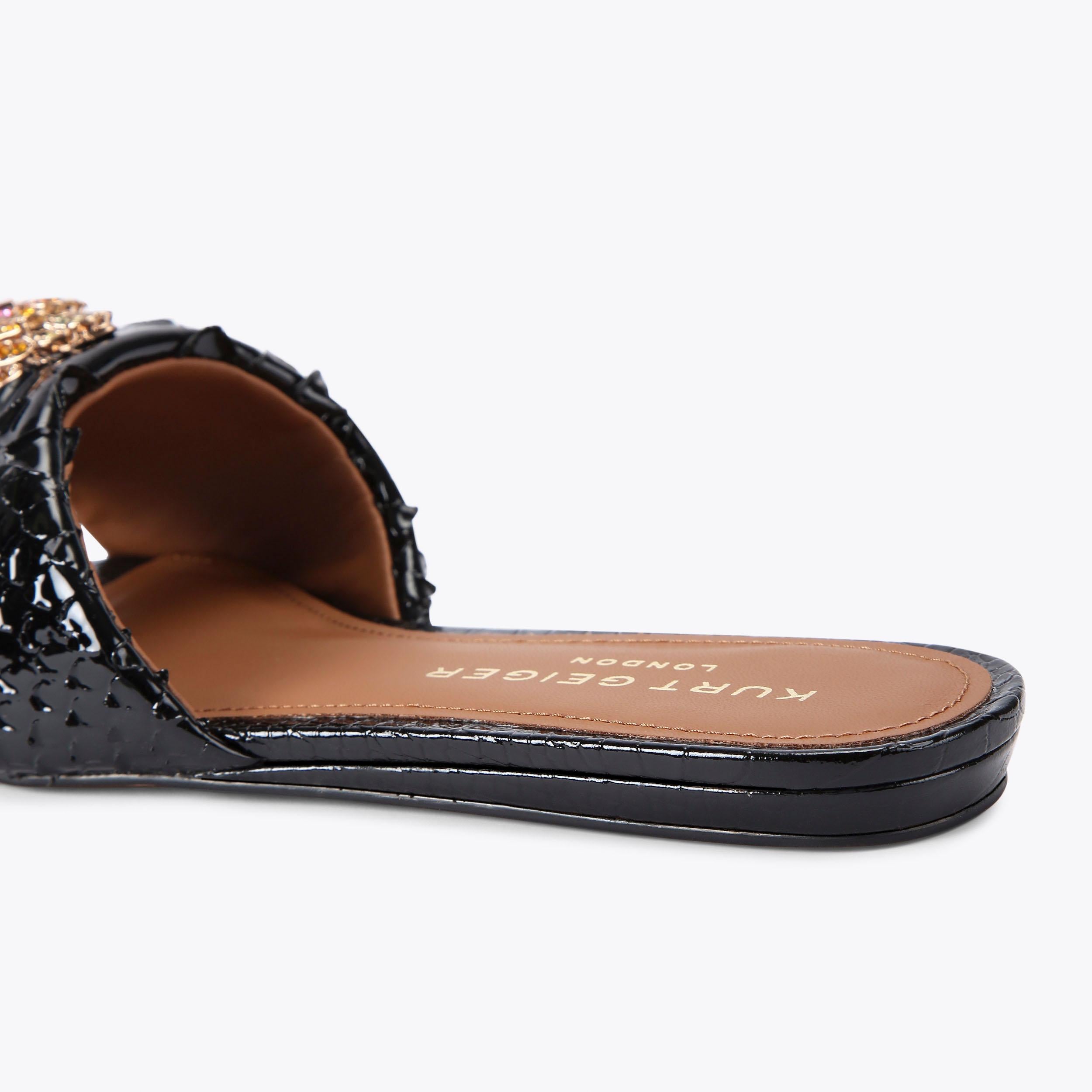 Kensington Flat Sandal — Black Lizard-Embossed Leather Slide, detail