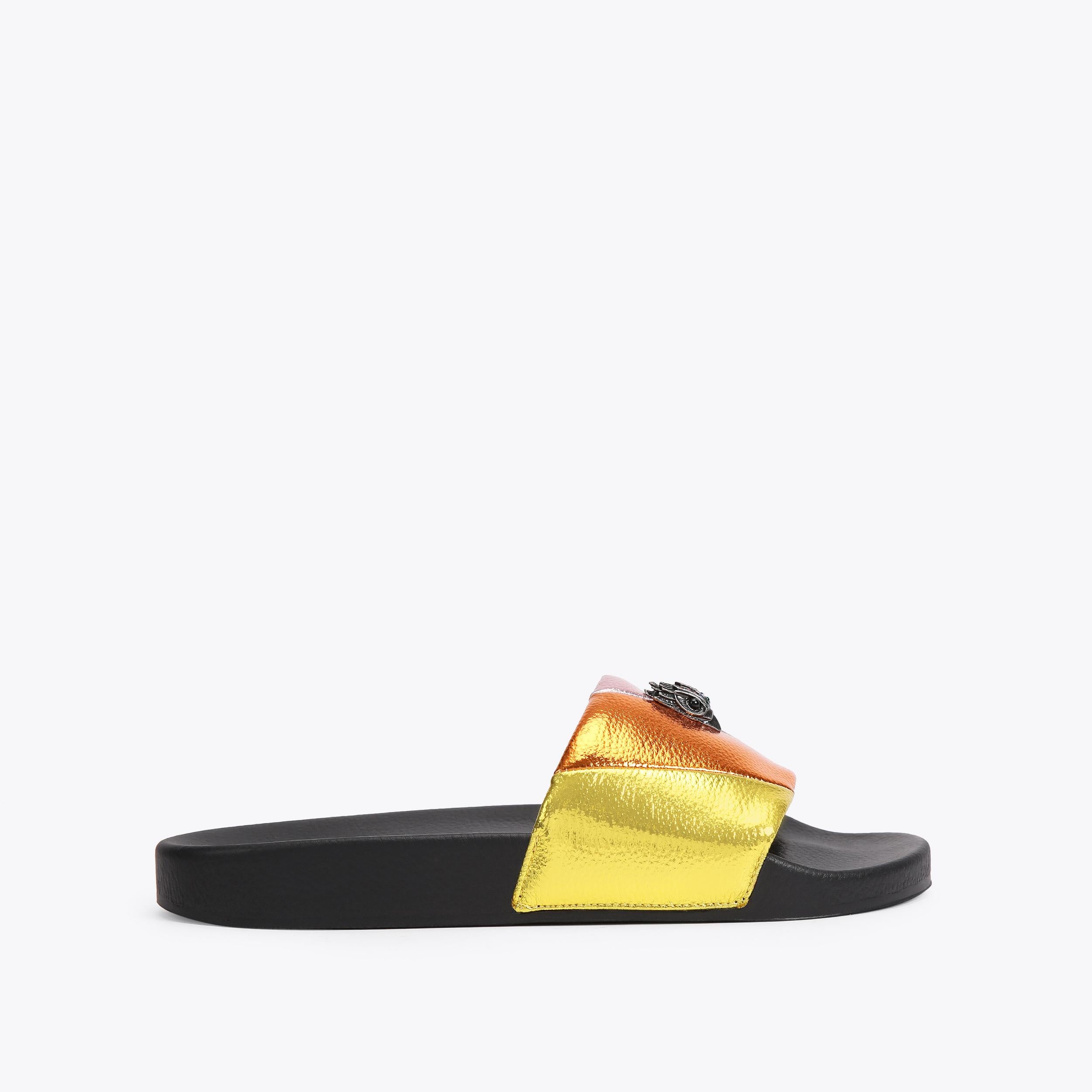 Meena Eagle — Rainbow Striped Slide, worn on foot