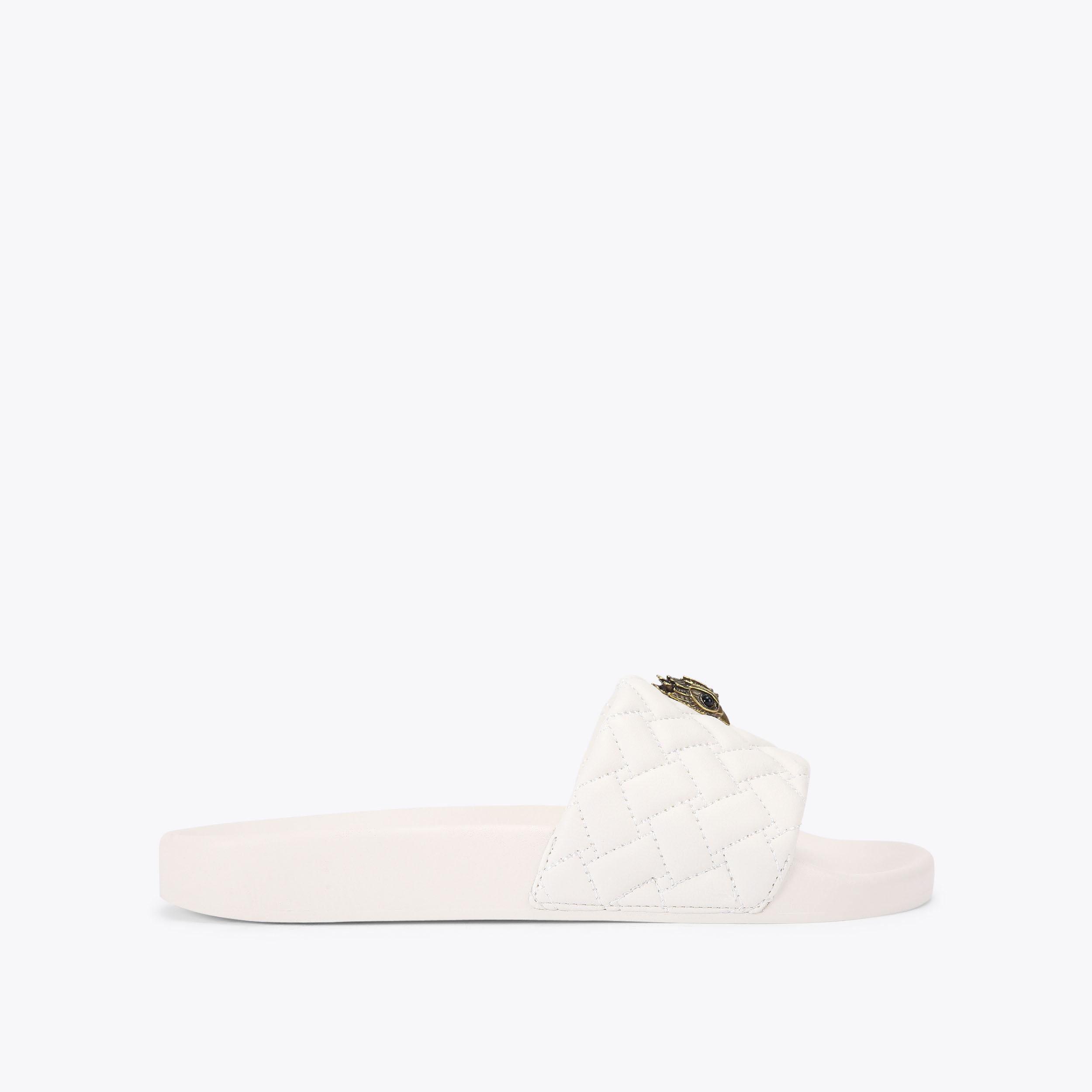 Meena Eagle — White Quilted Slide, side profile