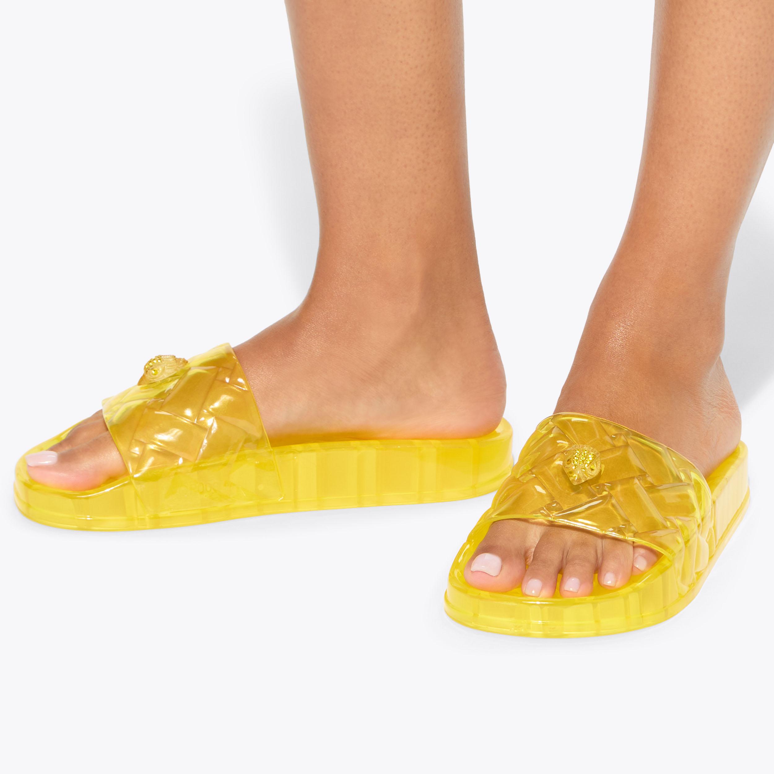 Meena Jelly — Yellow Transparent Slide, worn on foot