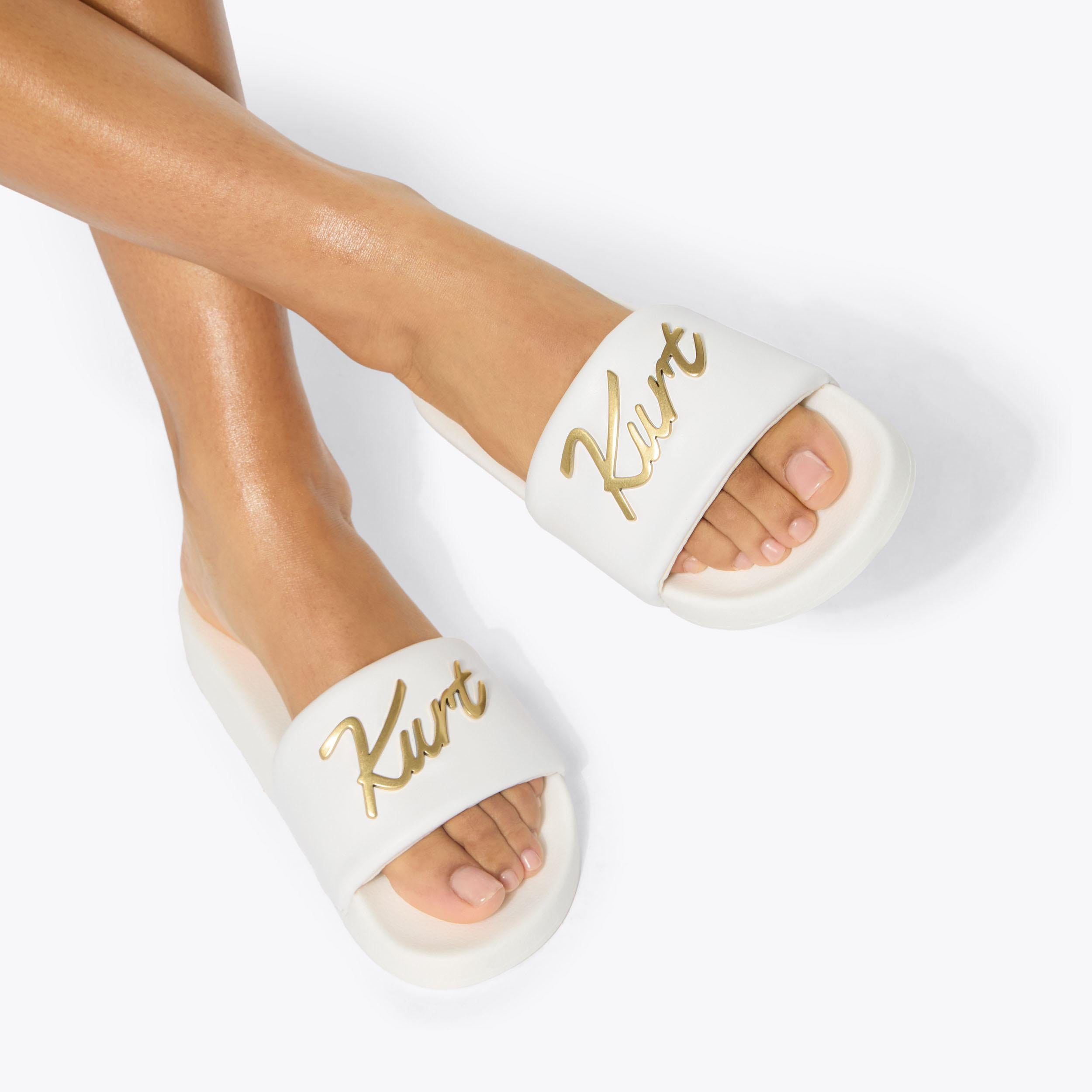 Meena Eagle Kurt — White Slide Sandal, worn on foot