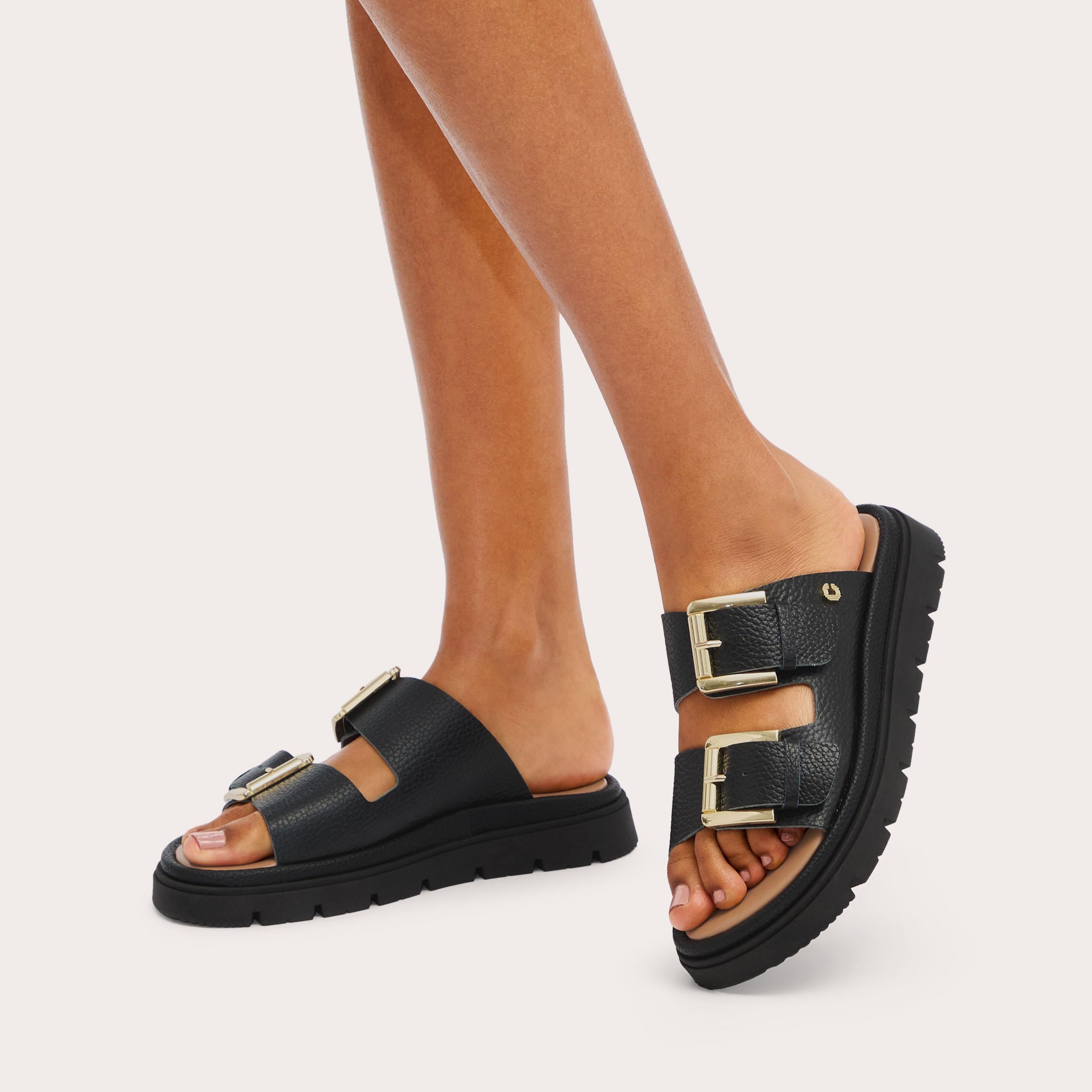 Pavilion — Black Leather Slide Sandal, worn on foot