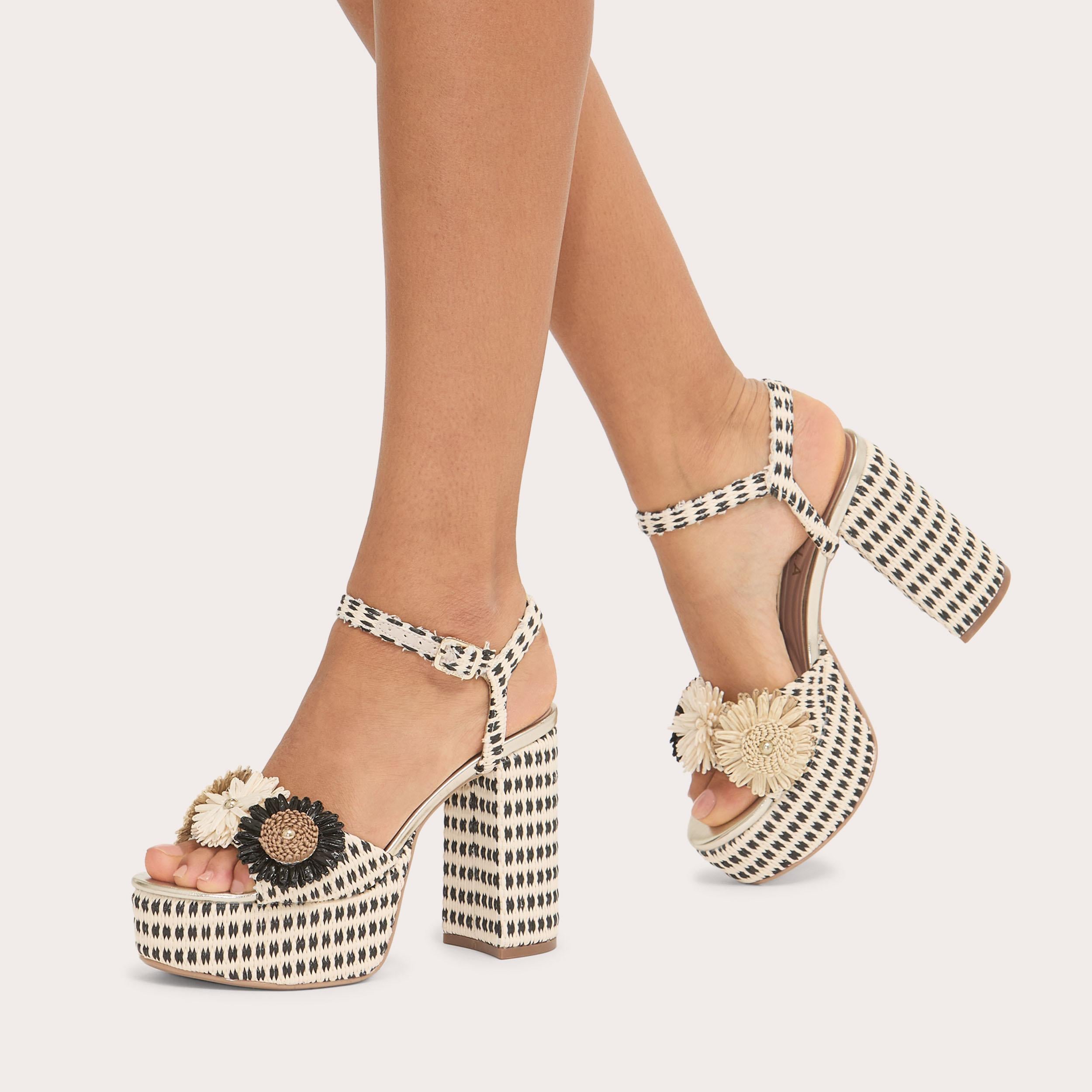 Sorrento Flower Platform — Black and Beige Raffia Heel, worn on foot