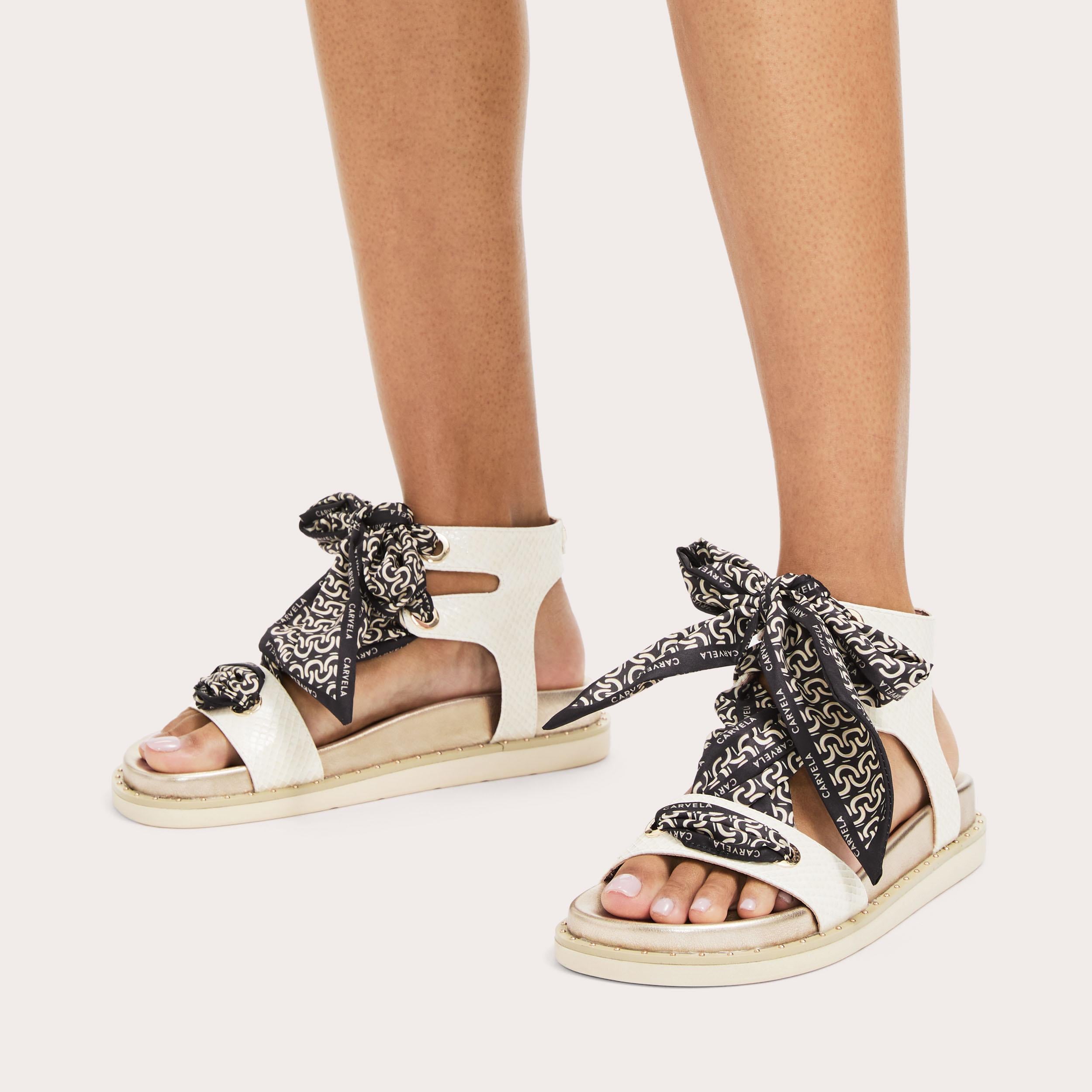 Sorrento Scarf Sandal — Bone Lizard-Embossed Sandal, worn on foot